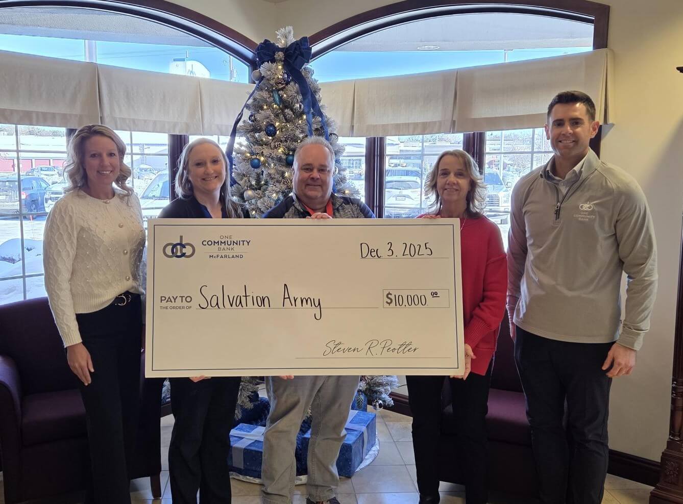 Big check photo with OCB colleagues and Salvation Army.