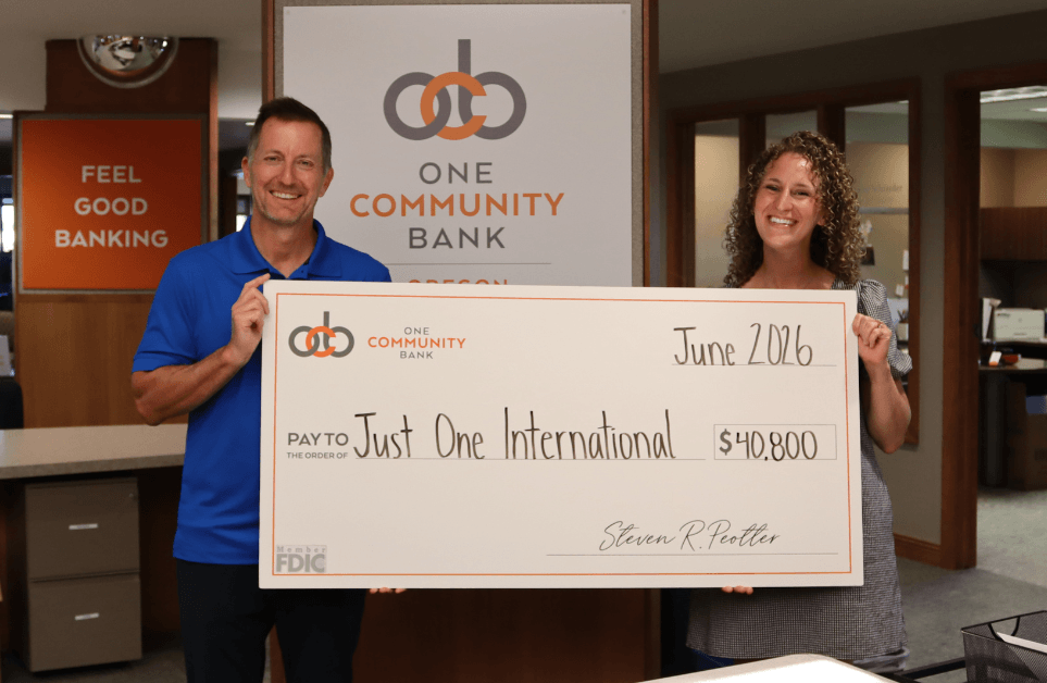 Big check photo with Preisdent and CEO Steve Peotter and President of Just One International